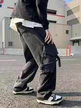 Men’s black wide-leg cargo pants with multiple pockets and drawstring waist in plus size full fit design