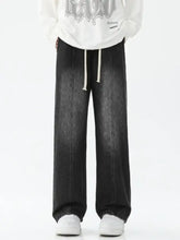 Men’s full size drawstring wide leg black denim jeans with faded wash and white waist drawstrings