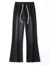 Men’s black denim wide leg jeans with white drawstrings and subtle stitching details plus size fit