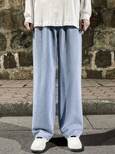 Light blue plus size wide leg jeans made of denim with a relaxed fit and drawstring waist for men