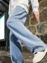 Men’s plus size light-wash denim wide leg jeans with a relaxed fit and visible stitching details