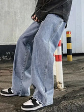 Men’s plus size light-wash denim wide leg jeans with relaxed straight cut and visible stitching details