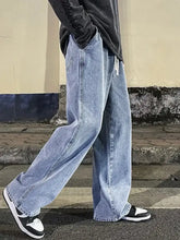 Men’s light-wash denim wide leg jeans plus size with relaxed fit and visible stitching details