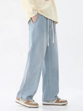 Men’s light-wash denim wide-leg jeans with a drawstring waistband in full and plus sizes