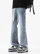 Men’s plus size light-wash denim wide leg jeans with a relaxed fit and white drawstring waist