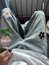Men’s light blue denim wide leg jeans with colorful embroidered floral patches in full size plus size design