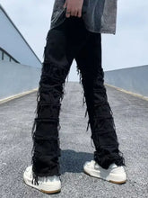 Black distressed slim fit jeans in plus size made of premium cotton with layered frayed detailing down the legs