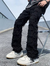 Men’s plus size slim-fit jeans in black distressed denim with layered frayed patches made from premium cotton