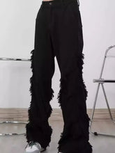 Men’s plus size black wide-leg jeans with fringe trim and frayed textured fabric detailing on lower legs