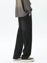 Men’s black wide-leg denim pants with a relaxed straight silhouette featuring gradient wash loose fit plus size design