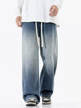 Men’s full size gradient wash wide leg denim jeans in faded blue with white drawstrings and wash wide leg design