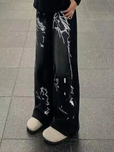 Men’s black wide-leg jeans with bold white graffiti print wide leg design in full size plus size options