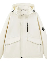 Men’s cream-colored full size long sleeve hooded windbreaker jacket with black drawstrings and sleeve logo patch