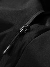 Black zipper with metallic pull tab and fashion tag on fabric of men’s plus size long sleeve hooded windbreaker jacket