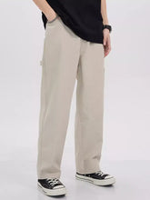 Beige men’s full size loose fit cargo jeans with side pockets featuring a relaxed fit for plus size wear