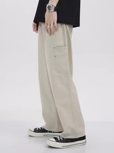 Men’s beige loose fit cargo jeans with relaxed fit and visible side pockets in plus size full size design