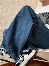 Men’s dark blue denim loose fit cargo jeans with relaxed wide-leg cut and elasticated cuffs in full size plus fit