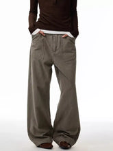 Olive green wide leg trousers with two front pockets featuring a loose fit design for plus size men