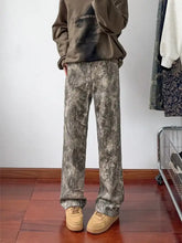 Men’s full size loose fit jeans featuring brown and gray tie-dye wide-leg design with a loose fit cut