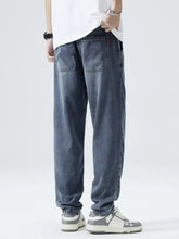 Mens full size loose fit jeans dark-wash denim with a relaxed straight-leg cut and classic back pockets view of the back side
