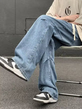 Men’s light-wash denim cargo loose fit jeans with wide-leg cut and visible stitching details in plus size fit jeans