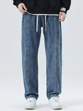 Men’s blue denim loose fit straight-leg jeans with white drawstrings and relaxed fit for plus size wear