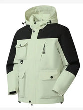 Men’s plus size hooded jacket in black and light green with multi pocket design and adjustable hood for outdoor use