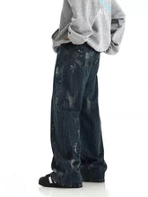 Men’s dark-wash denim paint splattered wide leg jeans with a wide-leg cut and distressing in plus size
