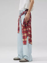 Men’s light blue denim wide leg jeans with red and beige plaid patchwork wide shirt tied around the waist