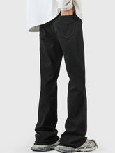 Men’s black straight-leg raw hem flare jeans with relaxed fit and classic back pockets shown from the back side