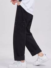 Men’s black relaxed fit cargo jeans with rolled cuffs and subtle stitching details in full size plus size design