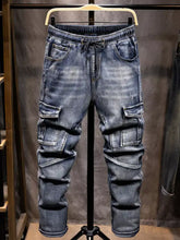 Men’s blue denim cargo drawstring jeans with multiple pockets and elastic waistband relaxed fit drawstring design