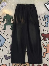 Men’s black relaxed fit wide-leg pants with elastic waistband and side pockets in full size relaxed fit jeans style
