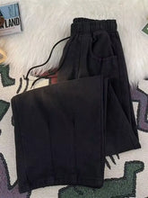Men’s full size relaxed fit jeans in black with a drawstring waist and subtle stitching details for comfortable fit jeans