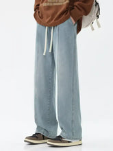 Light-wash denim men’s full size relaxed fit wide leg jeans with drawstring waistband for plus size comfort