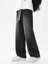 Men’s black wide-leg denim jeans with faded wash and visible stitching in relaxed fit wide leg plus size design