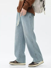 Men’s light-wash denim jeans with relaxed fit wide leg and white drawstring waist in full size plus sizes available