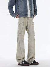 Men’s full size ripped wide beige distressed denim jeans with visible seam stitching and ripped wide leg details