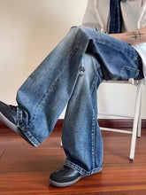 Men’s blue denim full size ripped wide-leg jeans with distressed thigh detail in plus size design