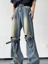 Men’s full size distressed blue denim ripped wide-leg jeans with black belt straps and ripped knees