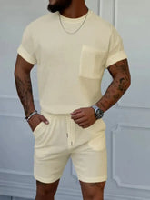 Cream-colored ribbed knit men’s full size round neck short sleeve top with chest pocket and matching shorts set plus size