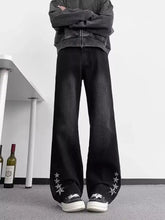 Men’s plus size black denim flare jeans with white star embroidery on cuffs for stylish casual wear