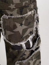 Men’s full size star print wide leg jeans in distressed camouflage with frayed edges and raw denim texture