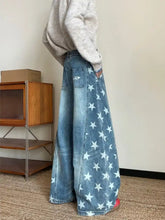 Men’s full size star print wide leg denim pants with faded blue wash and white star pattern in plus size