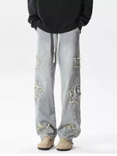 Men’s light-wash denim wide leg jeans with distressed star-shaped patches in plus size design