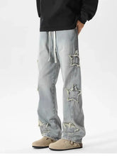 Men’s light-wash wide leg jeans with distressed star-shaped cutouts and a drawstring waistband in plus size