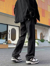 Men’s full size straight leg jeans in black denim with faded wash and visible stitching details