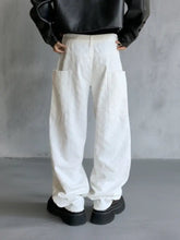 Men’s white full size textured wide-leg pants featuring loose fit cargo style with large front pockets