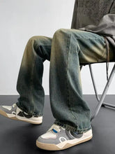 Men’s full size vintage wash loose fit jeans in dark-wash denim with a green to blue faded gradient effect