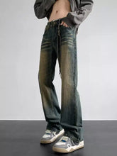 Men’s full size vintage wash loose fit dark-wash denim jeans with faded distressed look and drawstring waist detail